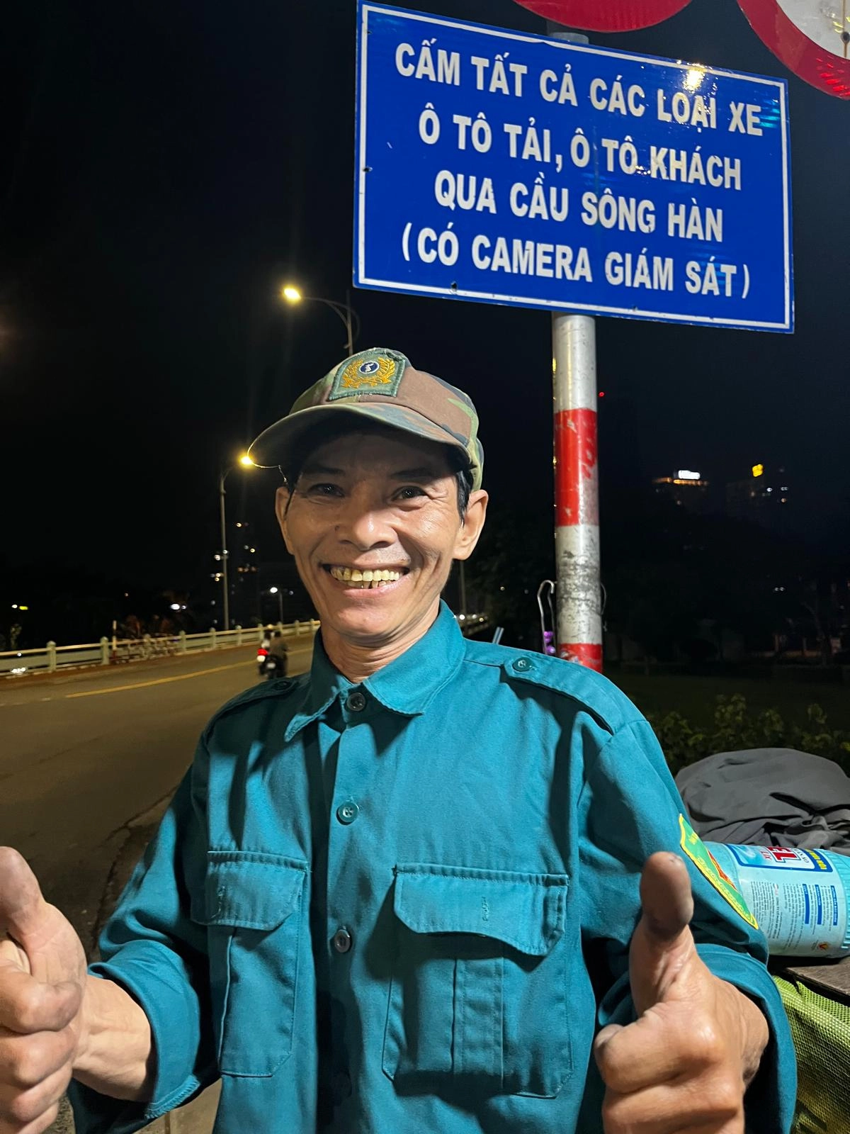 an image of a gorgeous asian man who works late night selling gas at night