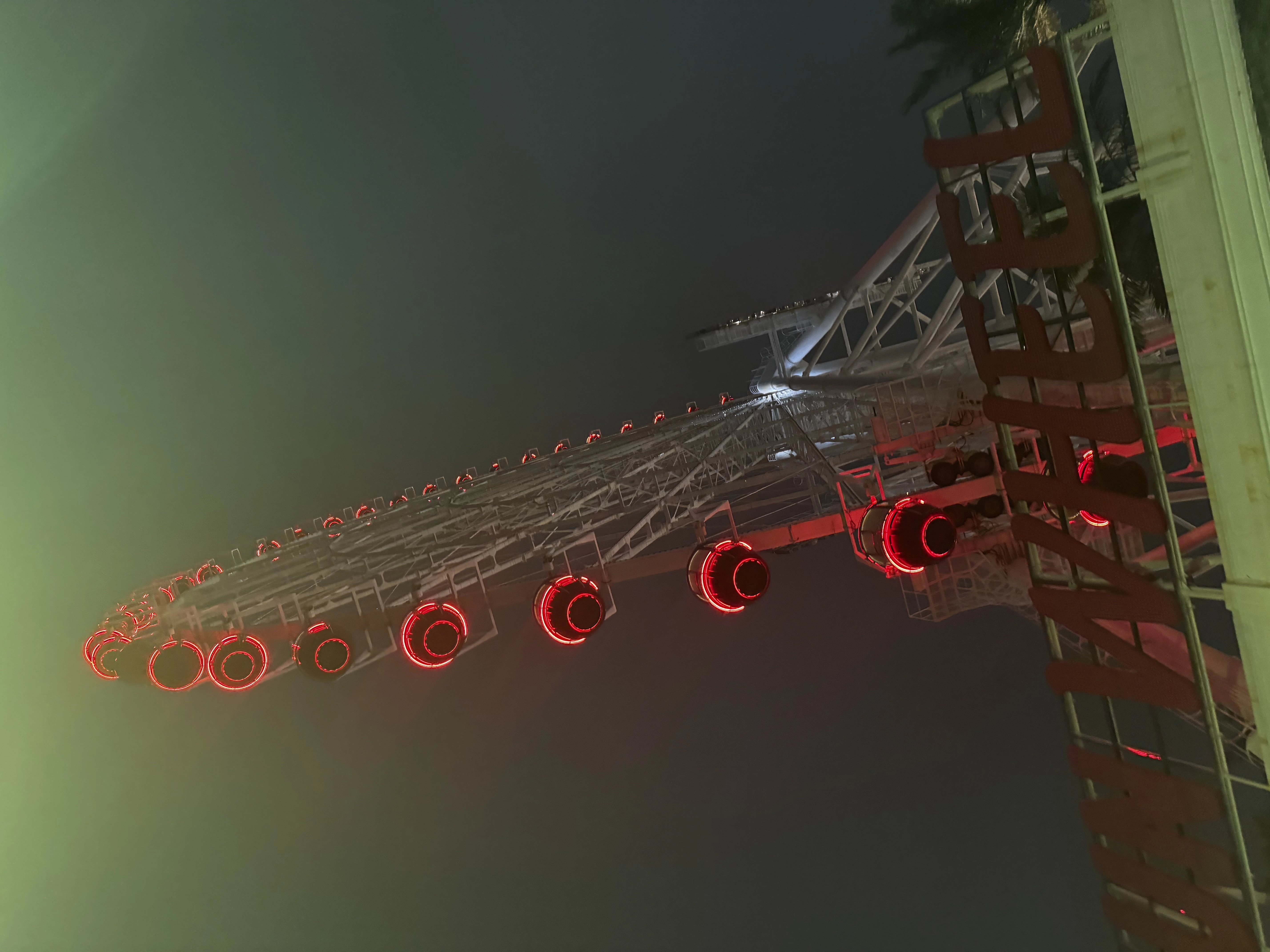 an image of a brightly lit up red ferris wheel in Asia Park, Da Nang on my first date in Vietnam