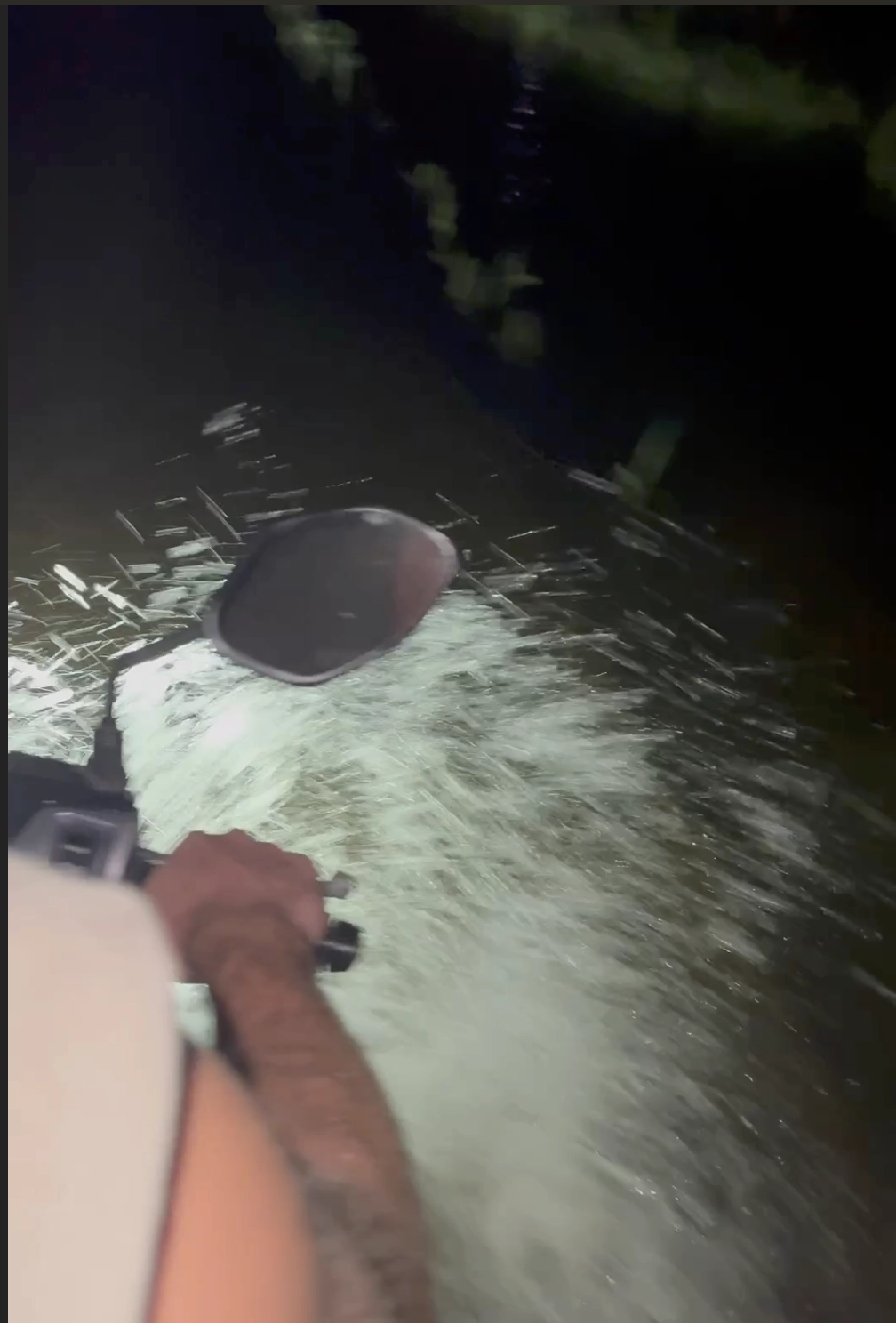 driving through knee high water in a rice field in Hoi An on a motorbike